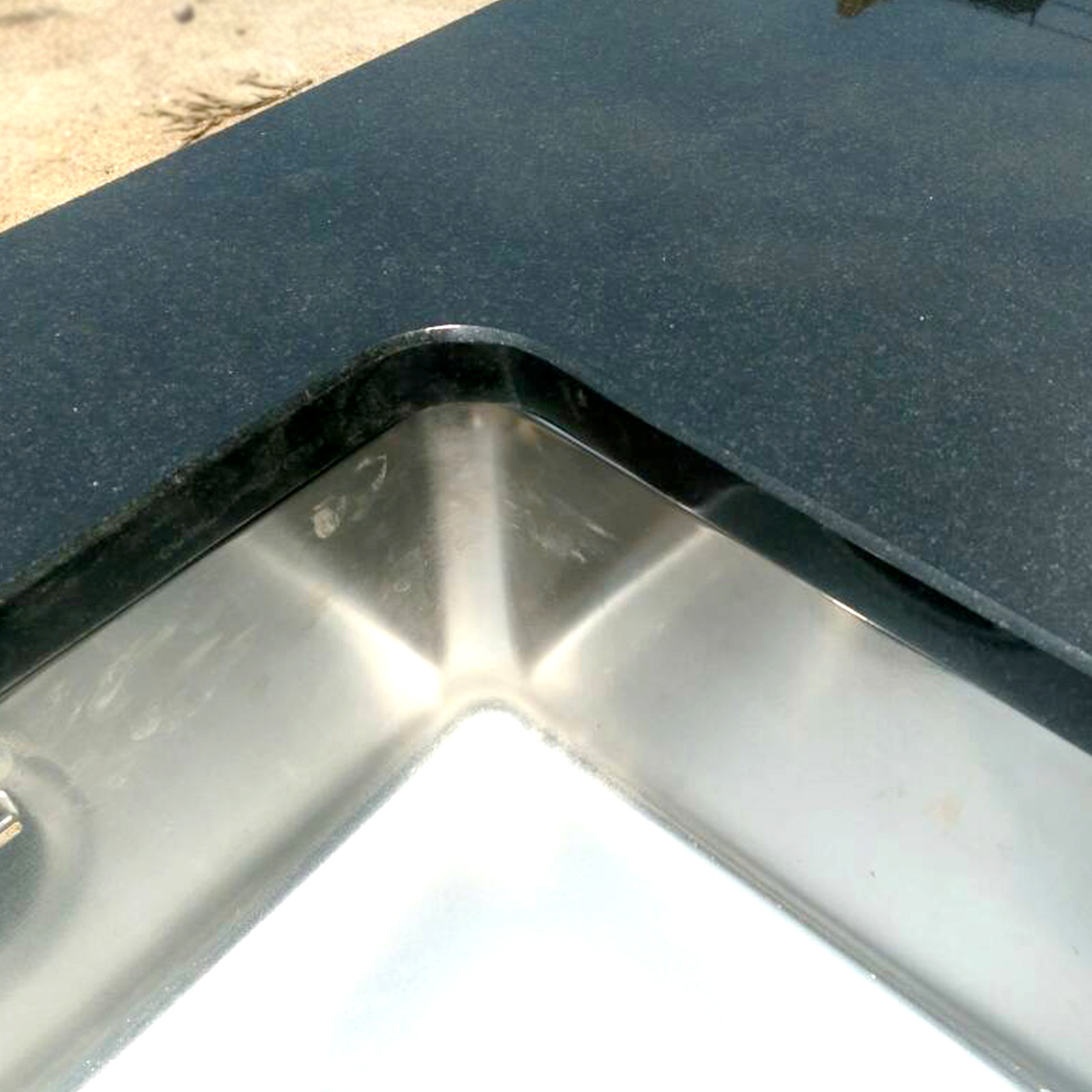Absolute black granite sink cutting of countertop