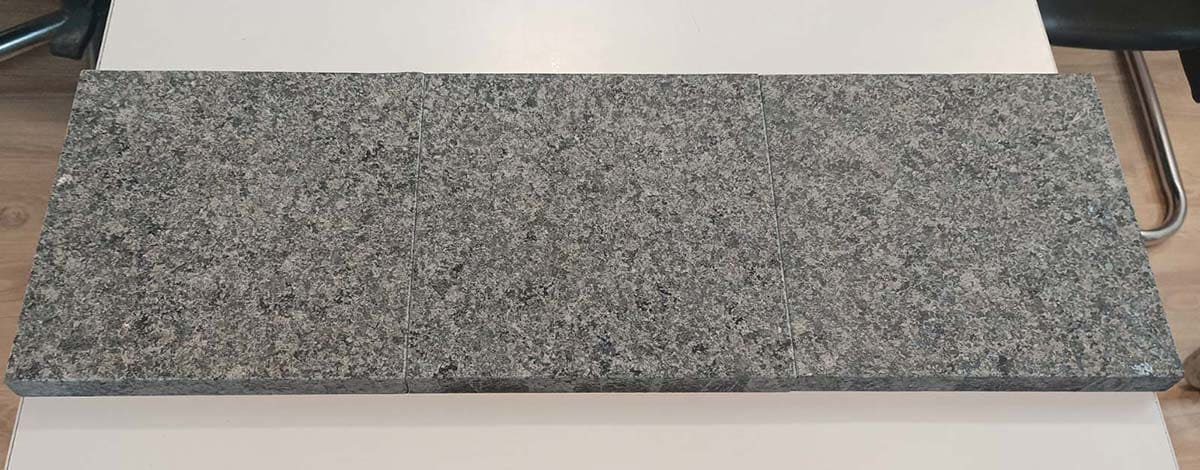 Black galaxy granite tiles in flamed finish