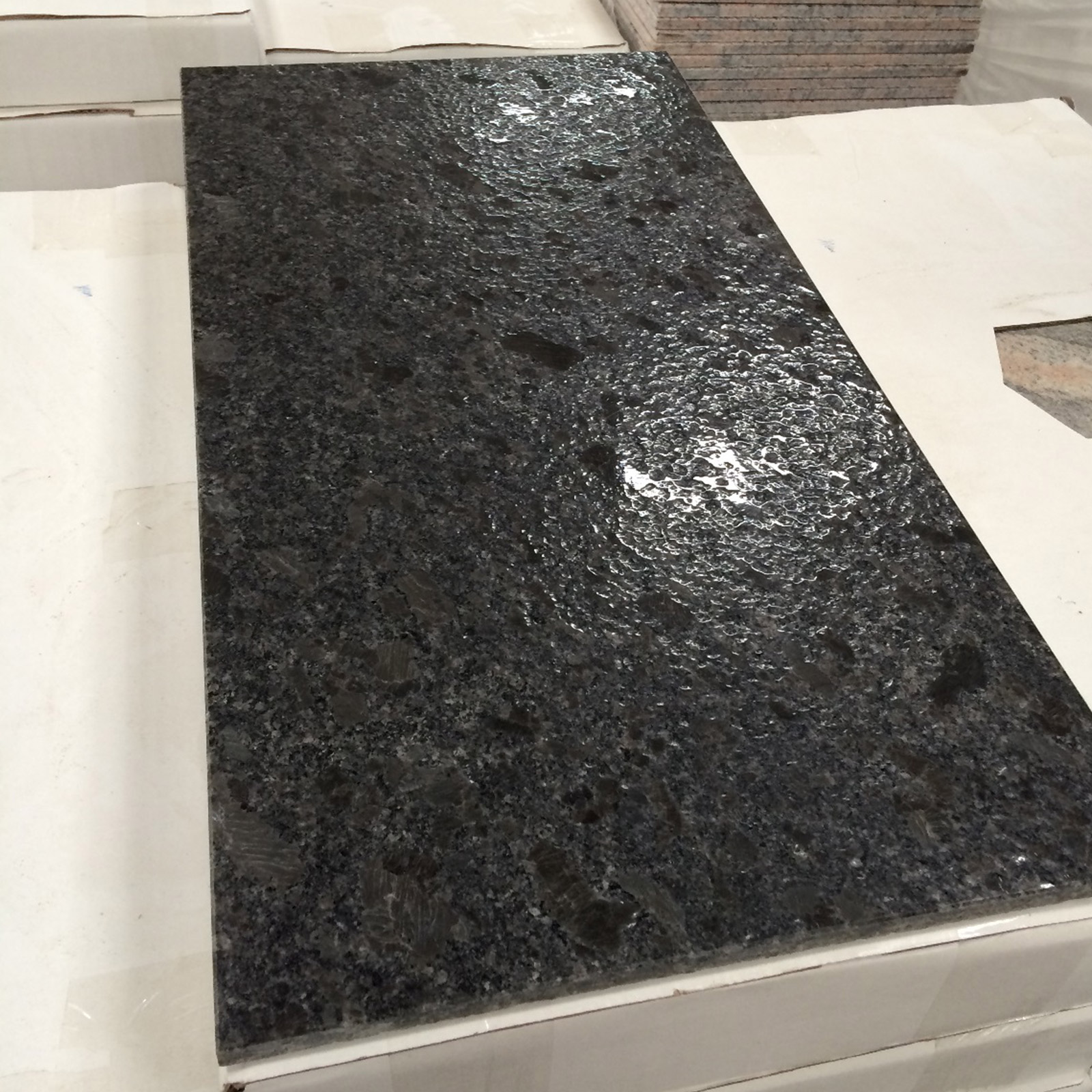 Steel grey granite tiles in lepatora finish